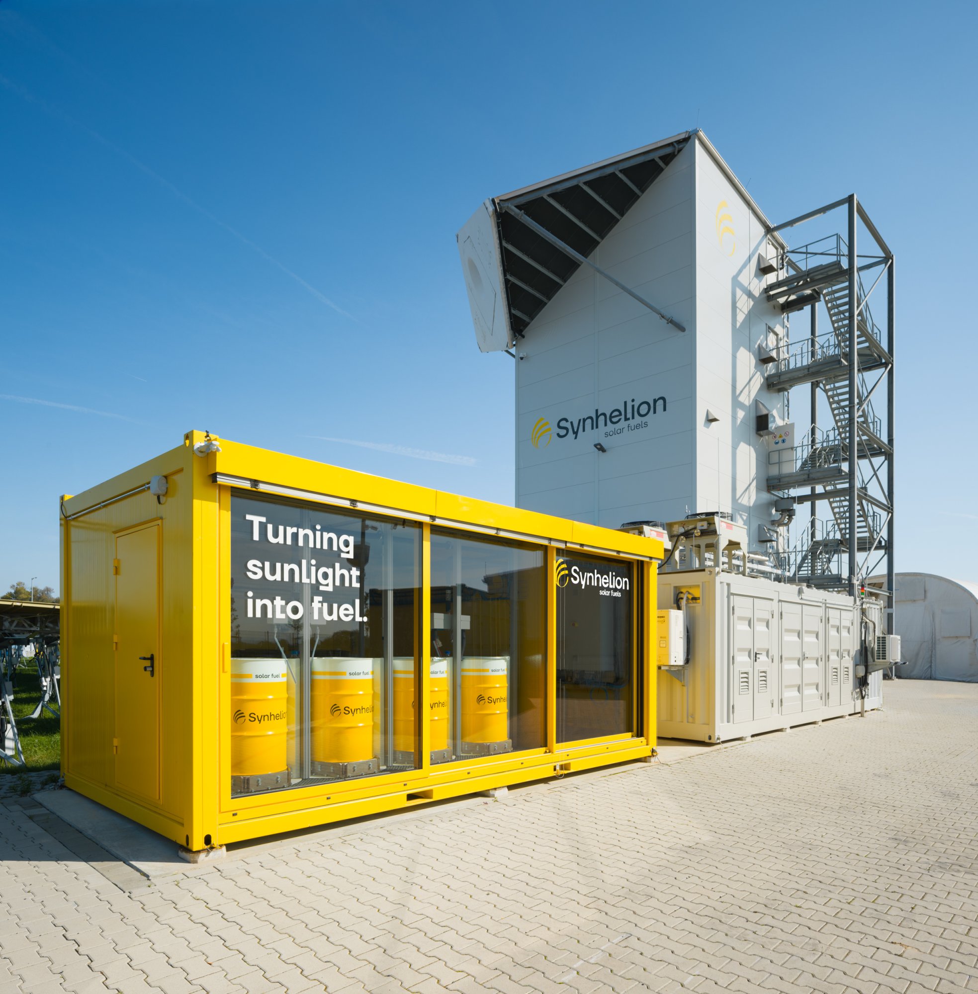 Solar tower of plant DAWN and storage and showroom solar synthetic crude oil.